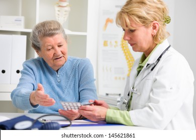 Doctor Prescribes Medication To The Senior Patient