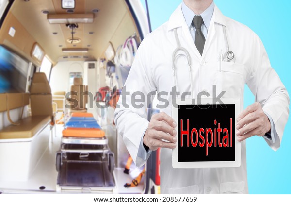 doctor presenting hospital\
word in digital tablet screen against Inside of an ambulance for\
the hospital