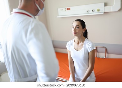 Doctor In Protective Medical Mask Examining Patient In Admission Department Of Hospital