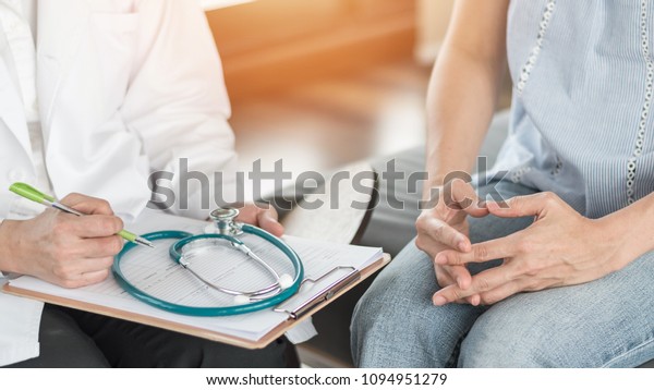 Doctor or psychiatrist consulting and diagnostic
examining stressful woman patient on obstetric - gynecological
female illness, or mental health in medical clinic or hospital
healthcare service
center