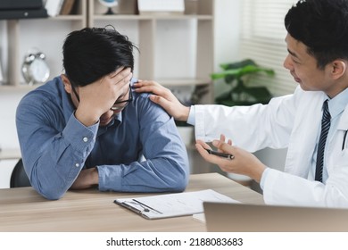 Doctor or psychiatrist shakes hands encouragement the patient and care having a consultation on diagnostic examination on male disease or mental illness in a clinic or hospital mental health service  - Shutterstock ID 2188083683