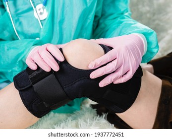 The Doctor Puts A Brace On The Injured Knee. Rupture Of The Internal Ligaments Of The Knee Joint In A Patient. Meniscus Injury.