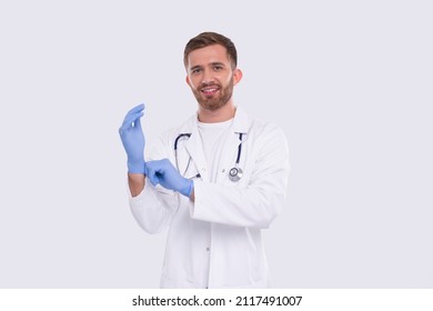 Doctor Puts On Gloves Isolated. Man Doctor Protection Workwear. Medical Concept Corona Virus. Gloves