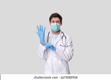 Doctor Puts on Gloves and Wearing Medical Mask. Medical Concept Corona Virus
