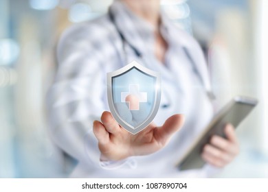 Doctor puts the protection of health on blurred background.