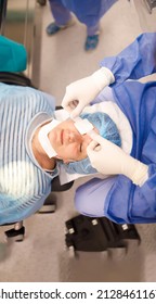 Doctor Putting An Eye Patch On His Patient After A Successful Cataract Operation