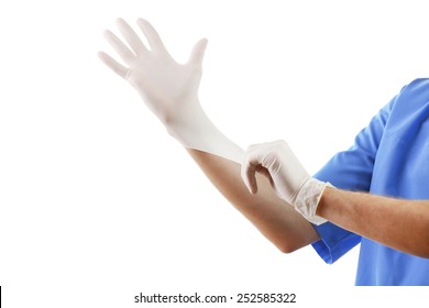 Doctor putting on sterile gloves isolated on white background - Shutterstock ID 252585322