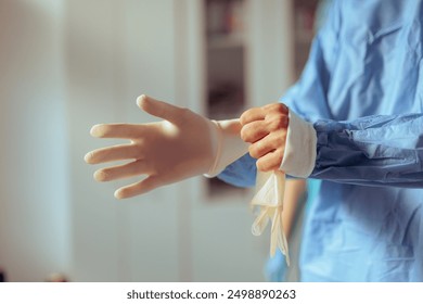 
Doctor Putting on Surgical Gloves Before Medical procedure. Surgeon getting ready for the surgery in the operating room  
 - Powered by Shutterstock