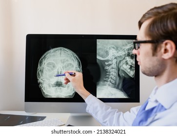 Doctor Radiologist Analyzing A Paranasal Sinus X-ray With Maxillary Sinusitis Of A Otorhinolaryngologist Patient.
