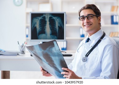 Doctor Radiologist Looking At X-ray Images