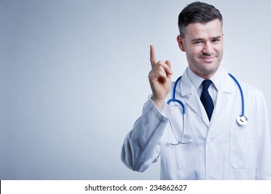 Doctor Raising Up His Finger To Give You Some Advice Or Suggestions