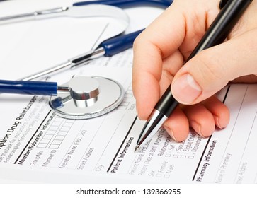 Doctor Ready To Fill Patient Information In Prescription Form