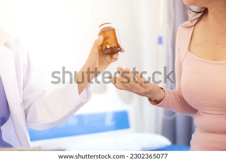 doctor is recommending dietary supplements to patients to take along with their medications to help prevent and speed up their recovery. The concept of using supplements to help restore health.