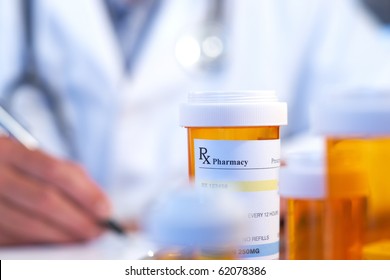Doctor with RX prescription drug bottle selective focus - Shutterstock ID 62078386