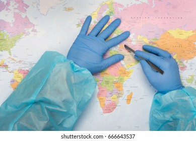 Doctor with scalpel pointing on the map to Syria