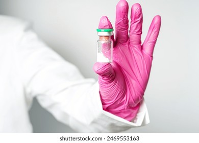 doctor or scientist holding a syringe with ampules vaccine, bottle for injection - Powered by Shutterstock