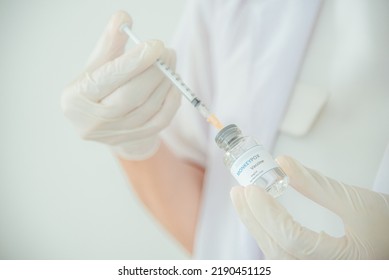 A Doctor Or Scientist Is Holding A Vaccine Vial For Monkeypox Or Clade.