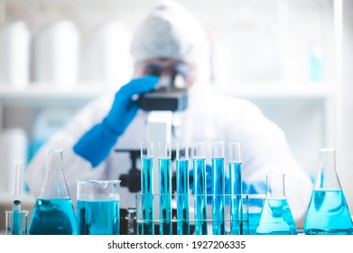 Doctor or scientist researcher working in laboratory holding a syringe with liquid virus vaccines, diseases, medical care, science, Concept fight against virus covid-19 coronavirus