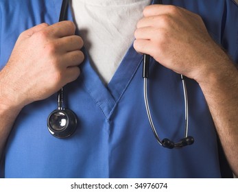 Doctor In Scrubs Holding Stethoscope