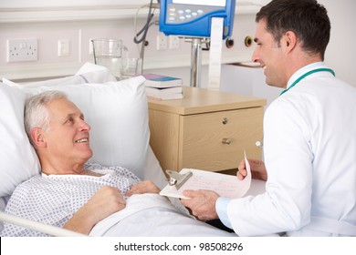 Doctor With Senior Male Patient On USA Hospital Ward