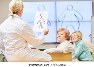 Doctor And Senior In A Nutritional Counseling In A Course Of The Adult Education Center