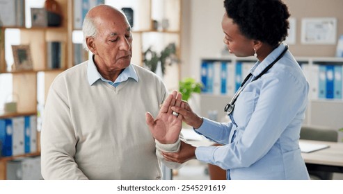 Doctor, senior patient and hand stretching for arthritis checkup, assessment and diagnosis at clinic. Woman, physiotherapist and male pensioner with wrist exercise for healthcare, help and support - Powered by Shutterstock