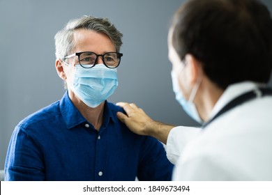 Doctor And Senior Patient Living In Assisted Home Wearing Mask