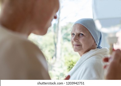 Doctor And Senior Patient With Terminal Illness In Hospital