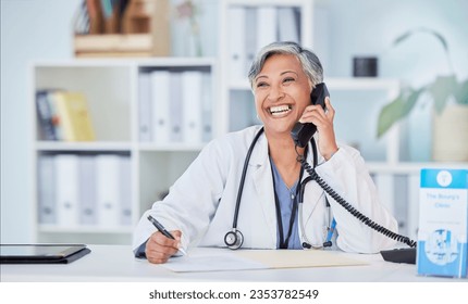 Doctor, senior woman in office and phone call, telehealth and happy writing with health insurance and paperwork. Healthcare, wellness and communication, documents and information with compliance - Powered by Shutterstock