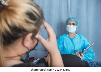 A Doctor Shares A Very Poor Prognosis To A Visibly Stressed Patient's Wife. At The Emergency Ward Of A Hospital. A Difficult And Tough Conversation.