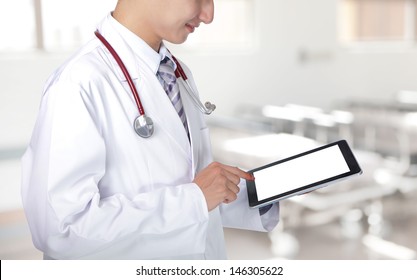 Doctor Showing Blank Tablet Pc In Hospital, Asian Model