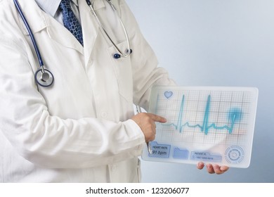 Doctor Showing ECG Data On Futuristic Transparent Tablet.