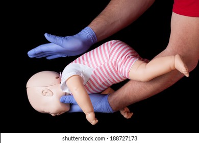 Doctor Showing First Aid For Choking Infant