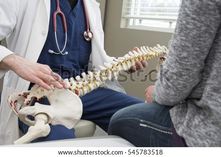 doctor showing patient what is wrong with their health