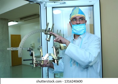 Doctor showing surgical equipment for implantation of a neurostimulator. It is used for deep brain stimulation for patients with torsion distonia. February 2, 2019. Kiev, Ukraine