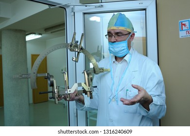 Doctor showing surgical equipment for implantation of a neurostimulator. It is used for deep brain stimulation for patients with torsion distonia. February 2, 2019. Kiev, Ukraine