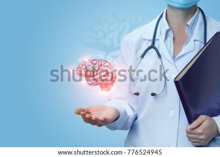 Doctor shows the brain of a person on a blue background.