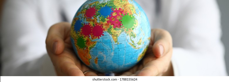 Doctor Shows Globe With Coronavirus, World Pandemic. Coronavirus Is Global Problem In World. Temporary Ban On Entry Into Countries. Crisis, Unlimited By Territory Continent And Requiring Cooperation