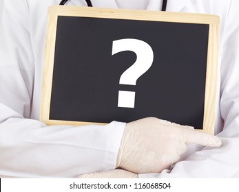 Doctor Shows Information On Blackboard: Question Mark