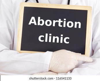 Doctor Shows Information On Blackboard: Abortion Clinic