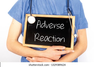 Doctor Shows Information On Blackboard: Adverse Reaction.  Medical Concept.