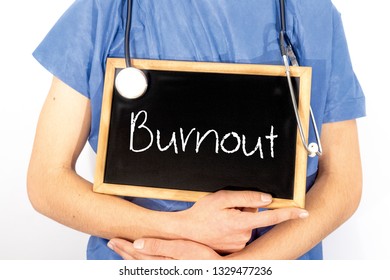 Doctor Shows Information On Blackboard: Burnout.  Medical Concept.