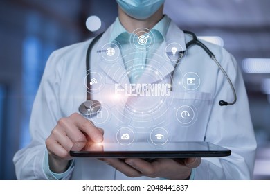 Doctor shows on a tablet the structure of e-learning on blurred background.