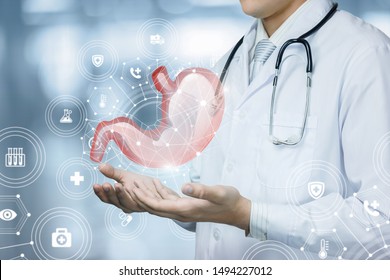 The doctor shows the patient stomach on blurred background.The doctor shows the patient stomach on blurred background. - Shutterstock ID 1494227012