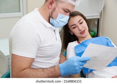 Doctor Shows The Patient An X-ray Image. Computer Diagnostics. Dental Tomography