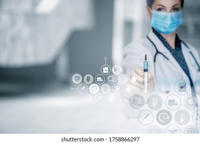 Doctor shows a syringe with a vaccine on a blurred background. - Shutterstock ID 1758866297