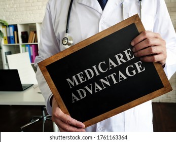 A Doctor Shows A Tablet Medicare Advantage.