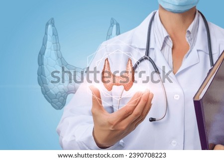 The doctor shows the thyroid gland on a blue background.
