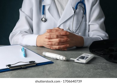 Doctor Sits With Folded Arms. Diabetes Test