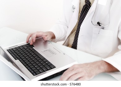 Doctor Sitting At Laptop Computer